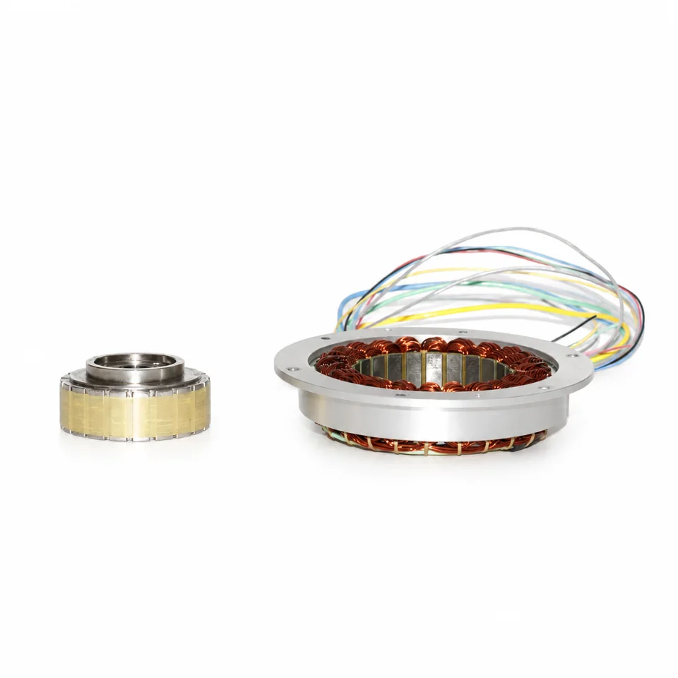 Hollow bore frameless kit silver flanged copper stator separate yellow wrapped segmented rotor raised silver center sleeve side oblique view.